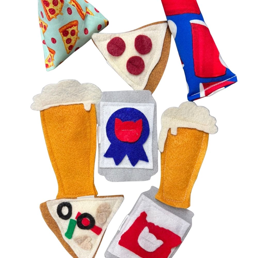 Pizza cat toy slice with felt veggie toppings displayed beside golden felt beer glass and gray beer can cat toys