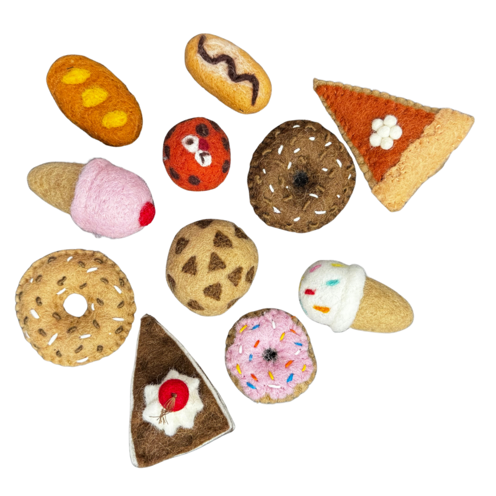 Assorted Dessert felt food toys on a white background