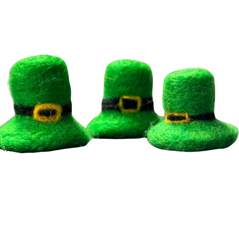 Three green felted wool leprechaun hat cat toys arranged together for St Patricks Day collection