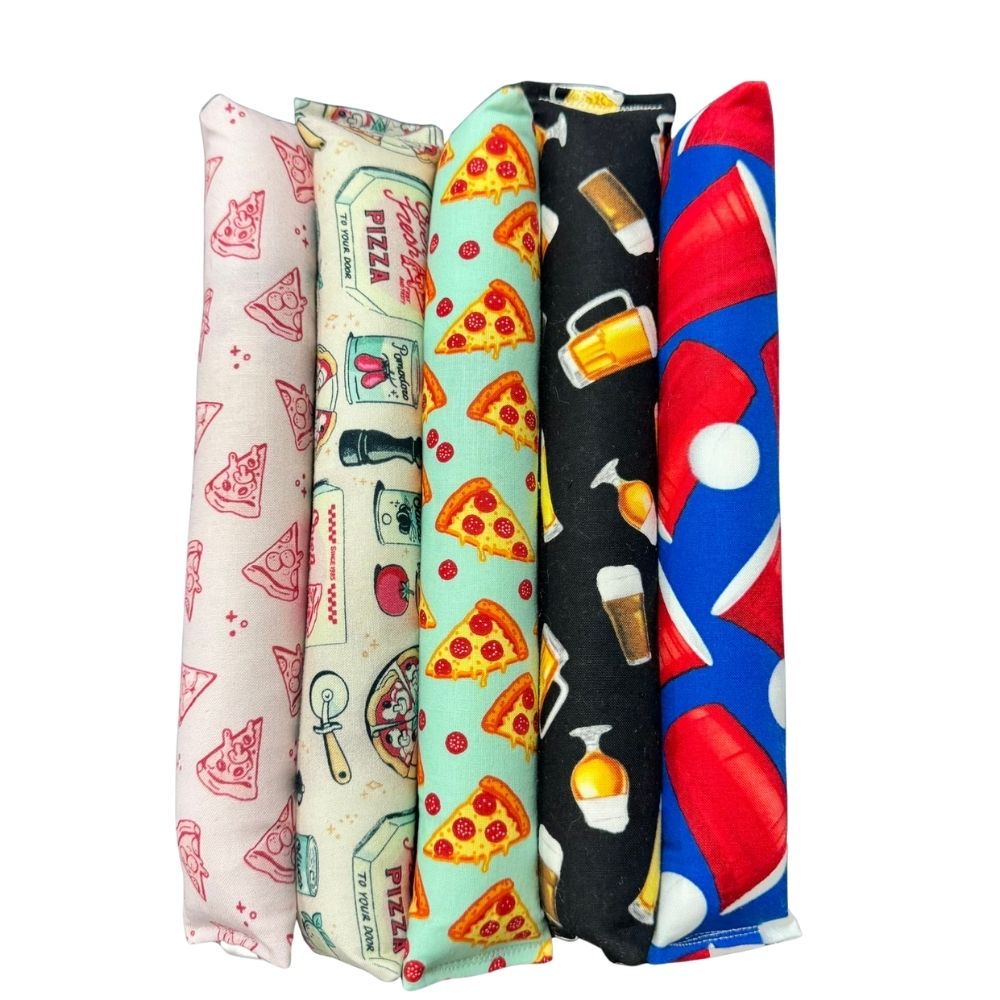 Group photo of pizza cat kicker toys with catnip showing classic pepperoni, sketch, and pizza parlor fabrics together.