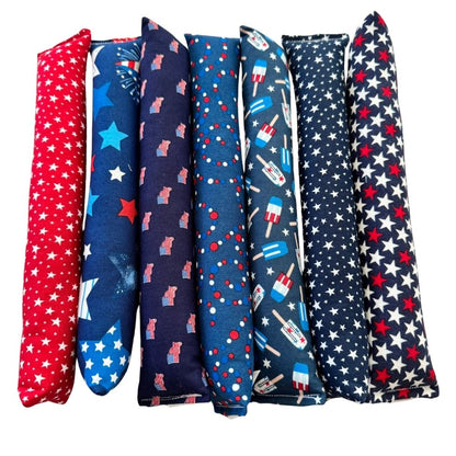 Handmade Kicker cat toys in patriotic stars, flags, fireworks, and popsicle prints filled with premium catnip