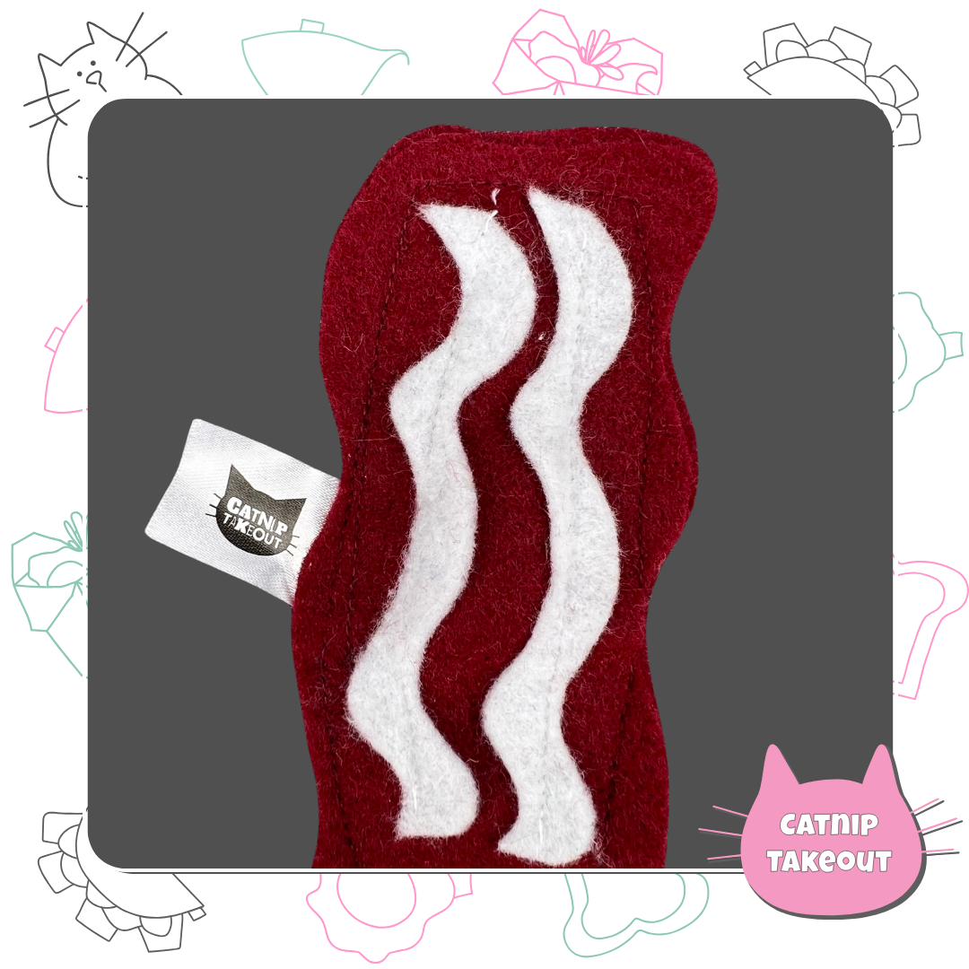 Bacon-Cat-Toy-Catnip-Organic-CatnipTakeout;A red and white felt piece with bacon on it