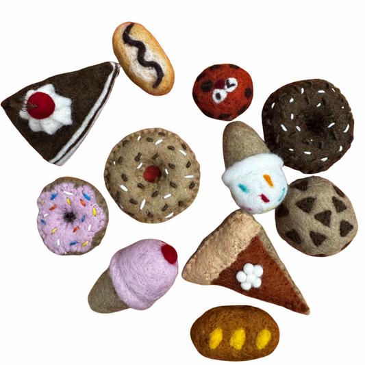 Collection of felt dessert toys on a white background 