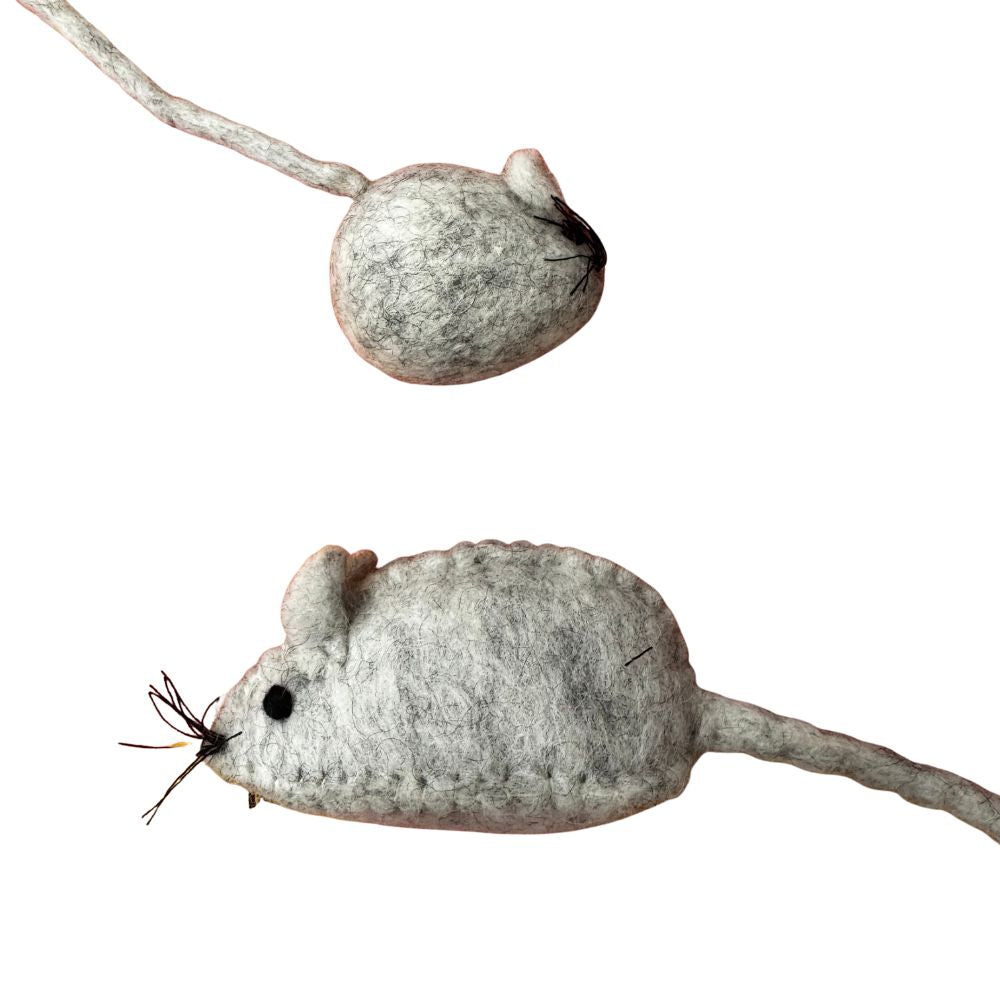 Two cream mouse toys on a white background