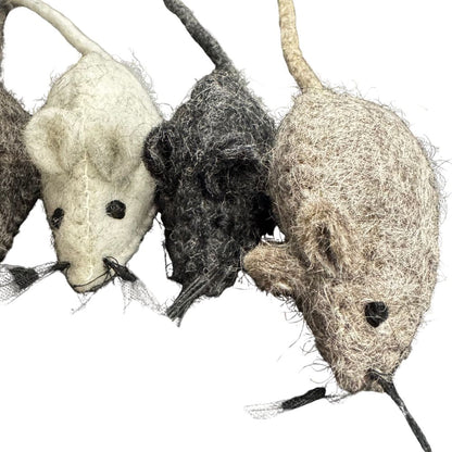 Three woolen mouse toys in different colors on a white background