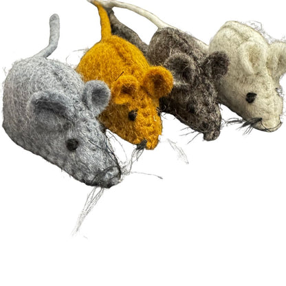 Four toy mice in different colors on a white background
