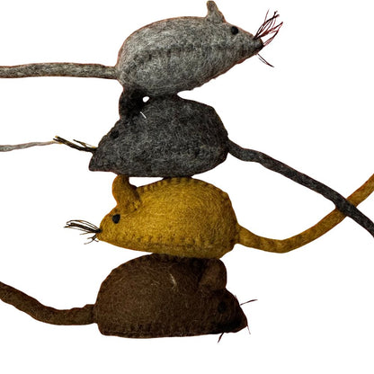 Stack of felted mouse toys in different colors on a white background