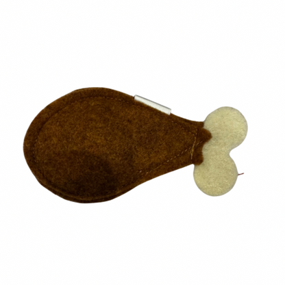 Brown and beige turkey cat toy shaped like a turkey lug on a white background