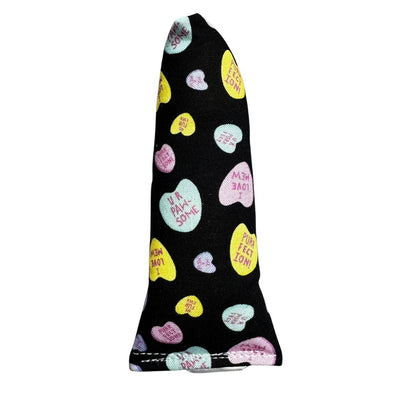 Handmade mini kicker cat toy in black fabric with pastel candy hearts, compact shape for tossing and carrying, filled with signature premium catnip. Made by CatnipTakeout.