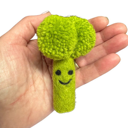 Broccoli Cat Toy bright green wool cat toy shaped like broccoli shown for scale with stitched smile, sprayed with catnip