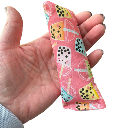 Pink boba tea pyramid cat toy filled with catnip for swatting and pouncing