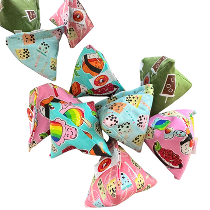 Boba tea pyramid cat toys spread out for batting, pouncing, and chasing play