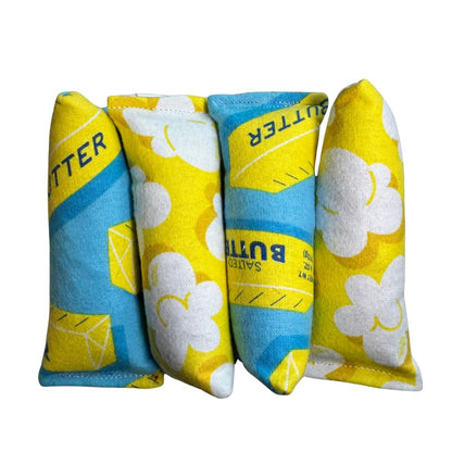 Handmade catnip mini kicker cat toys in popcorn and butter fabric, soft flannel toys sized for batting, bunny kicks, and energetic interactive play by CatnipTakeout