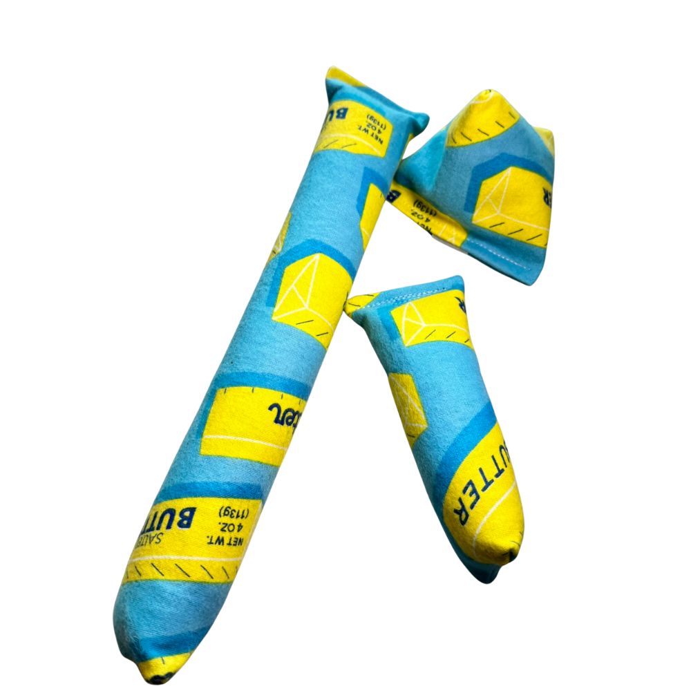 Butter print catnip toys including a full-size kicker, mini kicker, and happy sack made with soft flannel fabric by CatnipTakeout