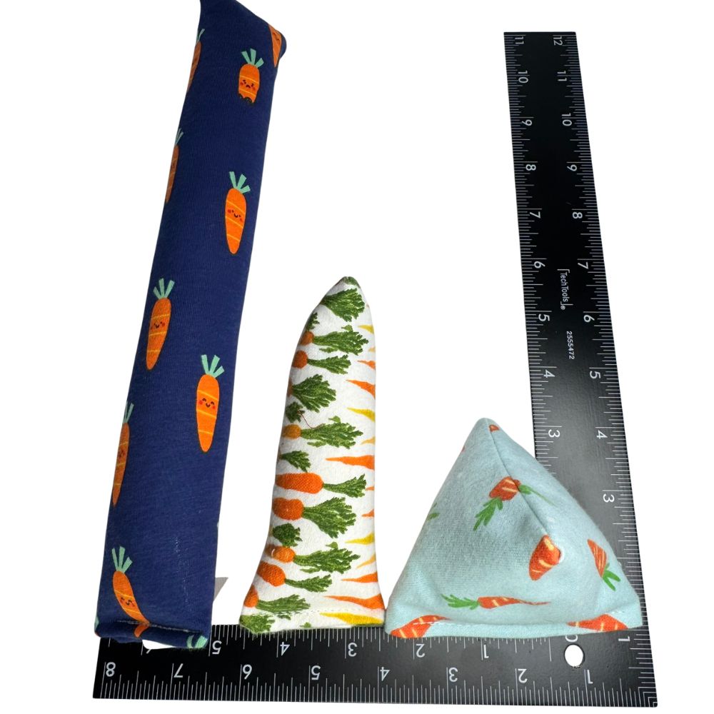 Carrot cat toy shapes shown beside rulers for size comparison.  Kicker, Mini-kicker and Happy Sacks