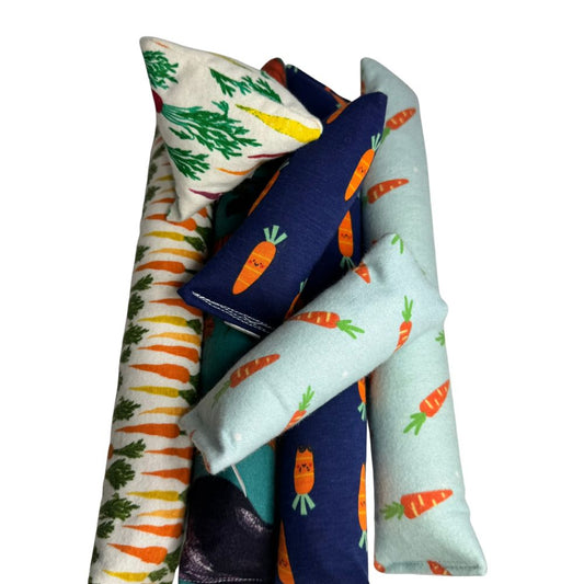 Carrot cat toy Happy Sacks and Mini Kickers grouped together for toss, chase, and carry play.