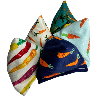 Carrot cat toy Happy Sacks lined up together for batting, tossing, and pounce play