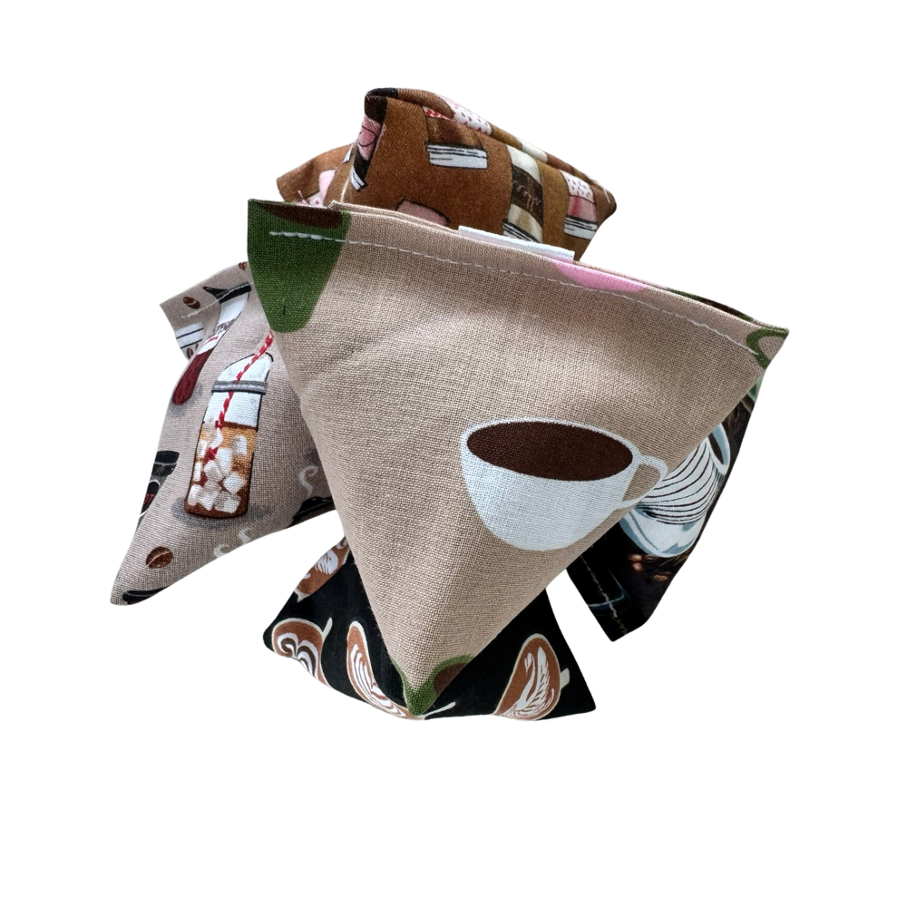 Stacked coffee cat toy Happy Sacks arranged for swatting, batting, and quick pounce play