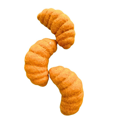 Three croissant-shaped wool cat toys displayed together, highlighting size, shape, and textured felt surface, sprayed with catnip our signature catnip spray