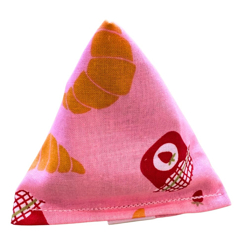 CatnipTakeout Croissant Happy Sack cat toy in a soft pyramid shape featuring mixed croissant bakery print fabrics with pastry illustrations and stitched edges, ideal for kitten play, batting, tossing, and independent catnip enrichment