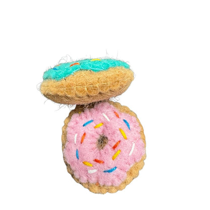 Stacked pink and blue wool Donut Cat Toys with catnip showing thickness and soft wool texture