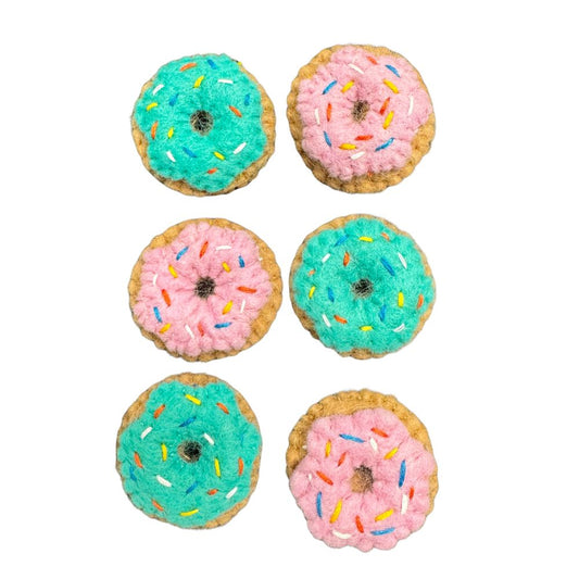 Pink and blue wool Donut Cat Toys with catnip grouped together, best cat toys for indoor cats