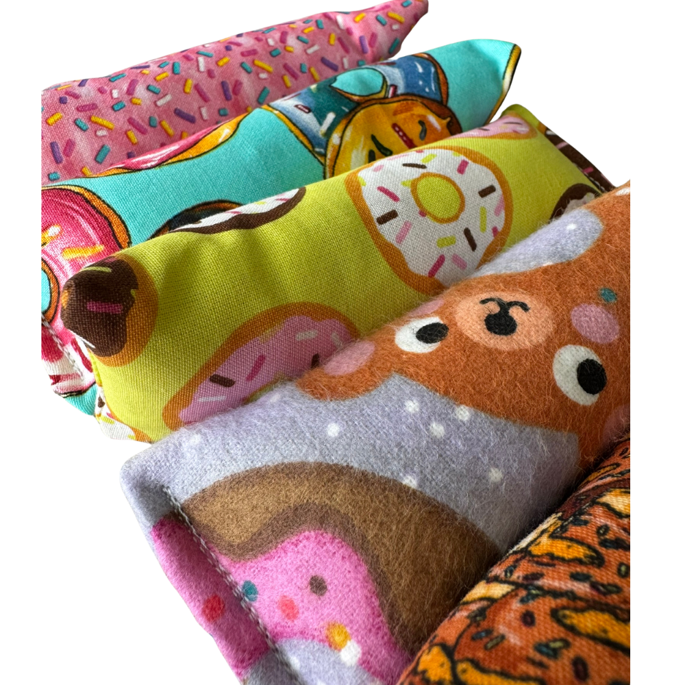 Close-up of donut cat toy Kickers in assorted donut assortments for grab-and-kick play sessions
