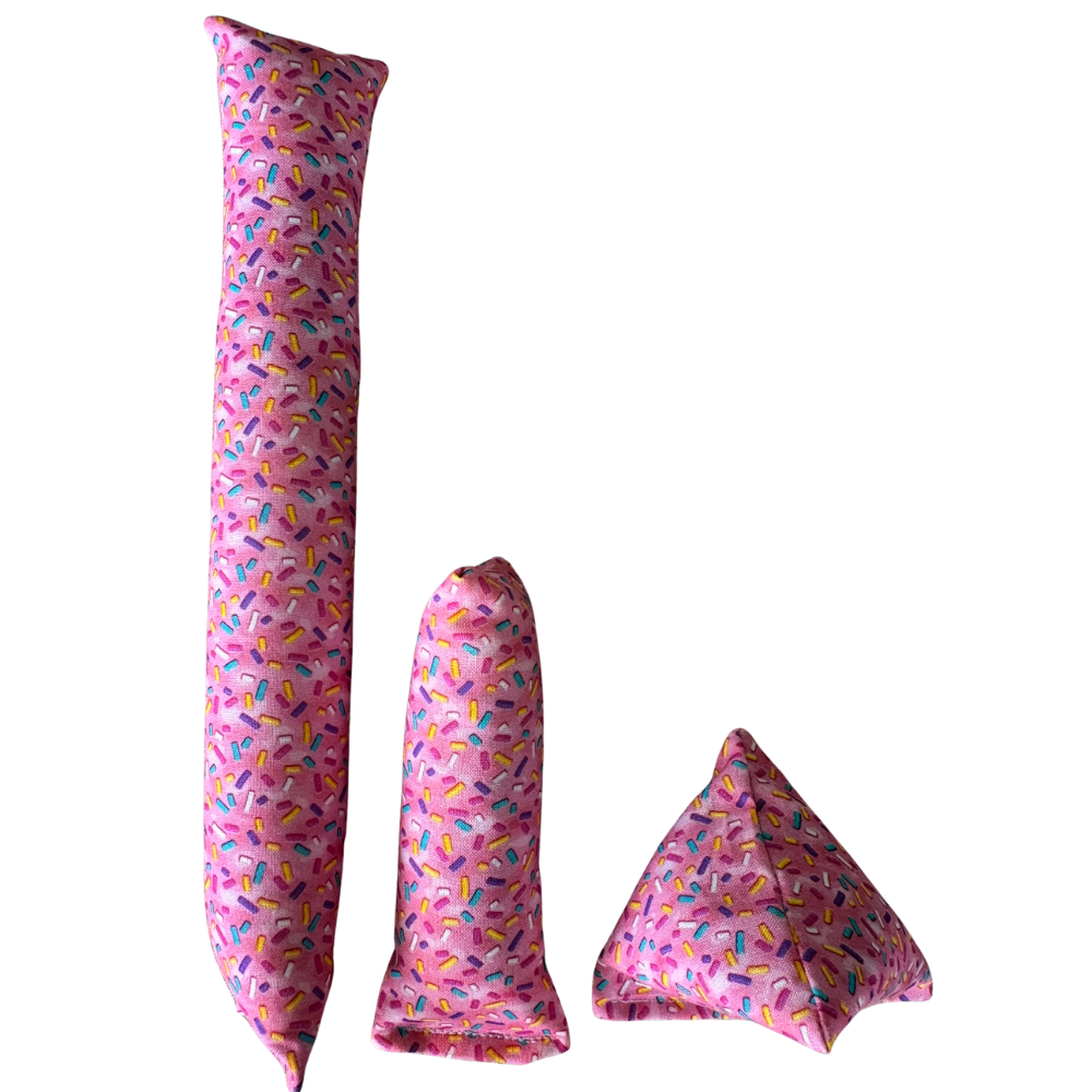 Pink donut cat toy shown in Kicker Mini Kicker and Happy Sack shapes for size and play comparison