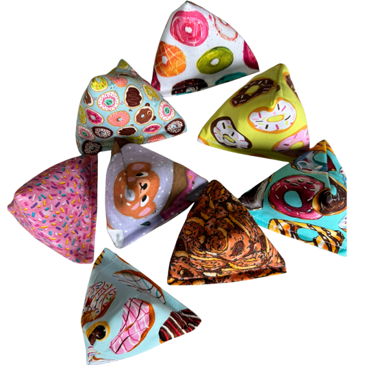 Assorted donut cat toy Happy Sacks shown together in multiple designs for batting and toss play