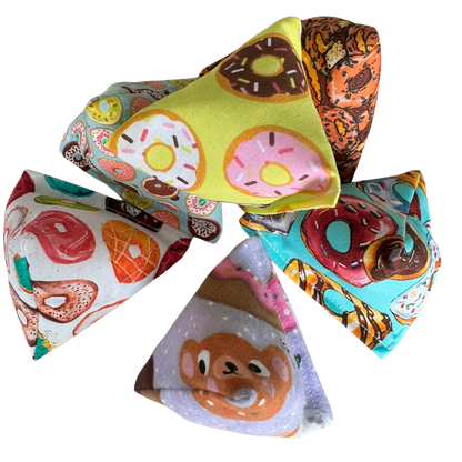 Donut cat toy Happy Sacks grouped together in several donut-inspired assortments for batting and toss play