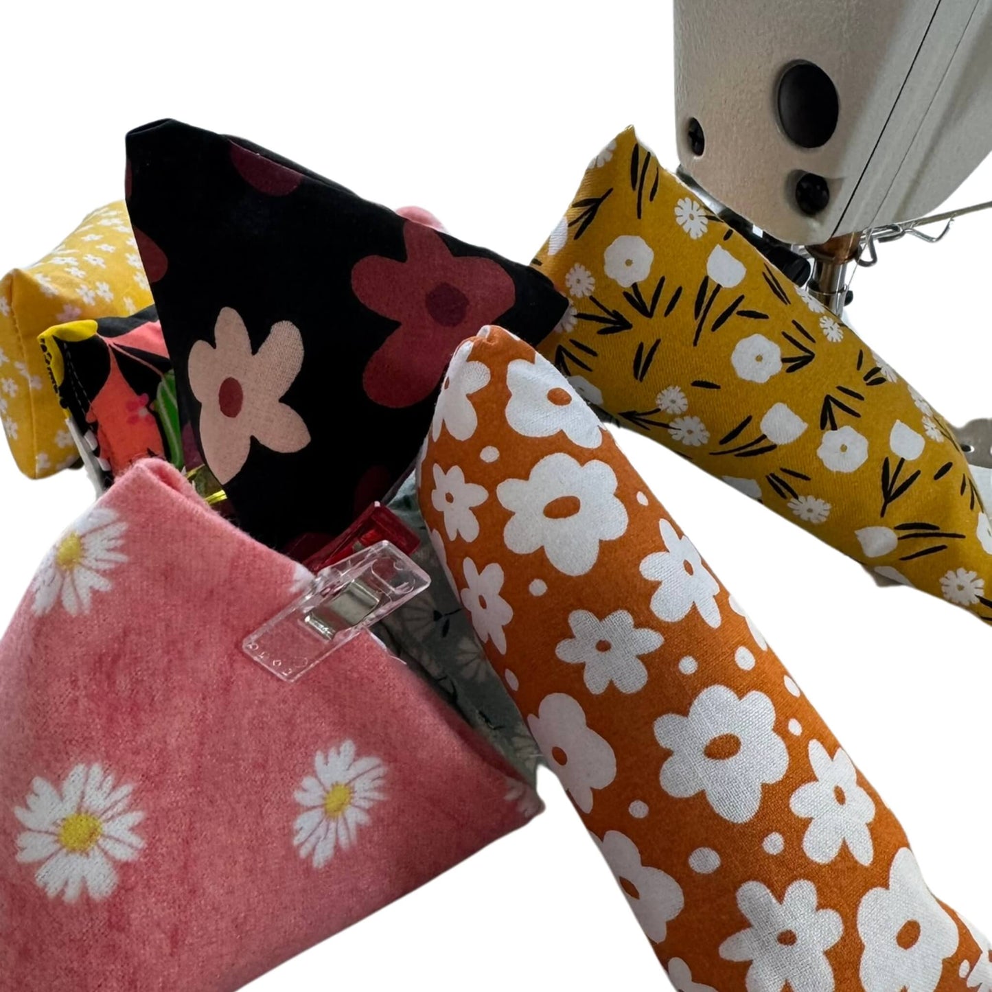 Small spring catnip toy with bright floral print in yellow, orange, and pink. Includes crinkle and stuffed with our signature fresh, aromatic premium catnip. Made by CatnipTakeout.