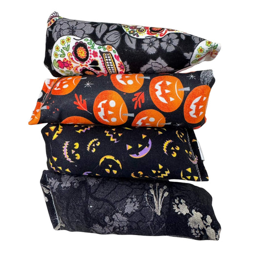 Halloween mini kicker cat toy with fabric featuring jack-o-lanterns, sugar skulls, and spooky icons. Made by CatnipTakeout.