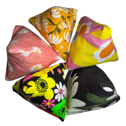 Collection of floral Happy Sack Cat Toys in spring-themed patterns, filled with fresh, aromatic premium catnip. Lightweight and fun. Made by CatnipTakeout.