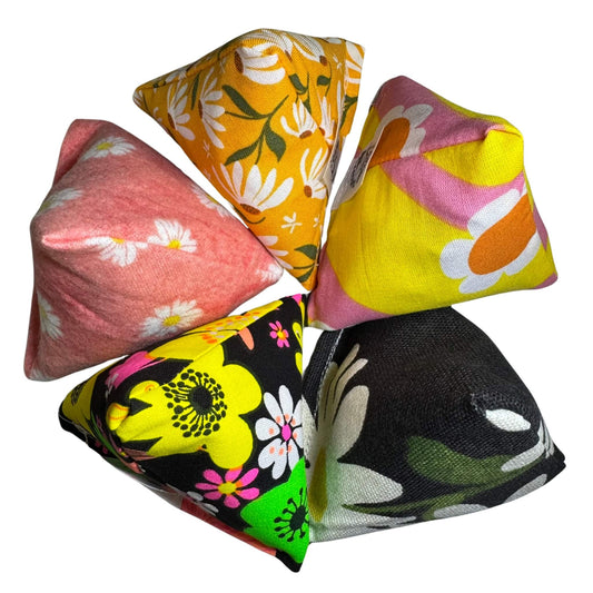 Collection of floral Happy Sack Cat Toys in spring-themed patterns, filled with fresh, aromatic premium catnip. Lightweight and fun. Made by CatnipTakeout.