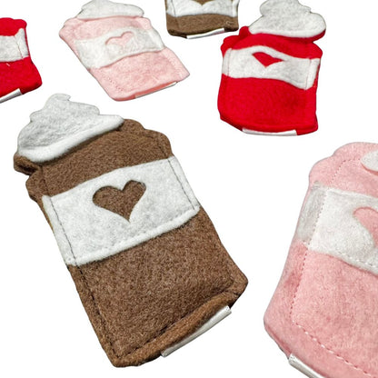 Close-up of handmade classic coffee brown felt latte cat toy with white sleeve and heart detail, filled with premium catnip. Made by CatnipTakeout