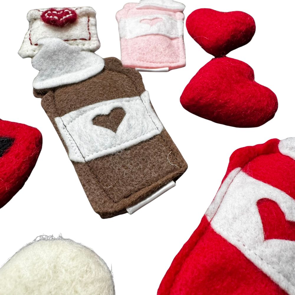 Close-up of handmade classic coffee brown felt latte cat toy with white sleeve and heart detail, filled with premium catnip. Made by CatnipTakeout.