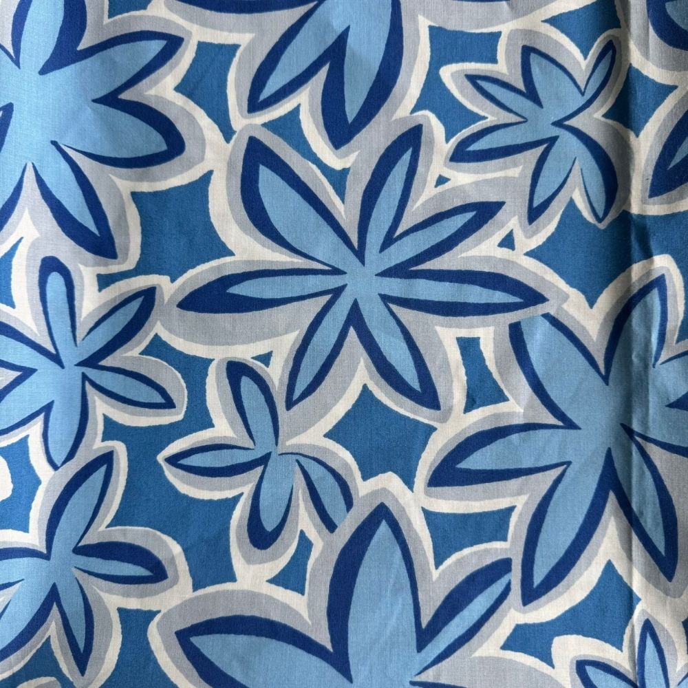 Blue Breeze Maui Vibes cat toy print with light blue background and navy and white retro plumeria flowers, used for handmade premium catnip toys.