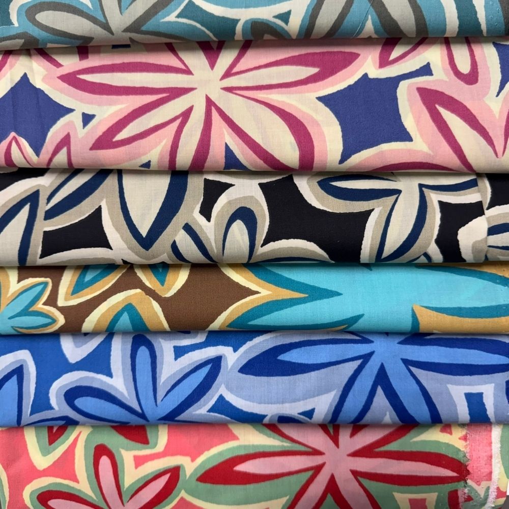 Six Maui Vibes retro plumeria fabric prints stacked together in different colorways for CatnipTakeout handmade cat toys with premium catnip.