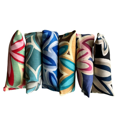 Maui Vibes cat toy styles in matching retro floral prints, showing handmade Kicker, Mini Kicker, and Happy Sack options for pouncing, batting, and catnip play.