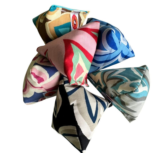 Maui Vibes Happy Sack cat toys in six retro plumeria prints, handmade with premium catnip for cats who love pouncing, batting, chasing, and tossing.