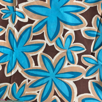 Island Sand Maui Vibes cat toy print with turquoise plumeria flowers on tan and brown background, used for handmade catnip toys for batting and pouncing.