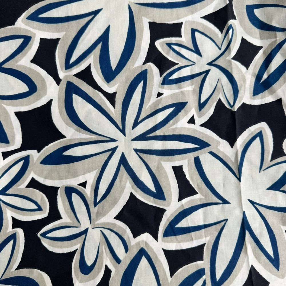 Midnight Plumeria Maui Vibes cat toy print with black background and cream and cobalt retro plumeria flowers, used for handmade catnip toys.