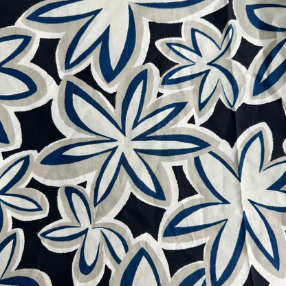 Midnight Plumeria Maui Vibes cat toy print with black background and cream and cobalt retro plumeria flowers, used for handmade catnip toys.