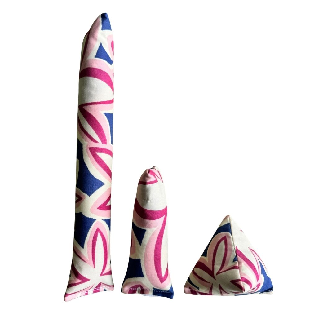 Maui Vibes Navy Orchid print cat toys shown as Kicker, Mini Kicker, and Happy Sack in cream, navy, and pink retro plumeria fabric.