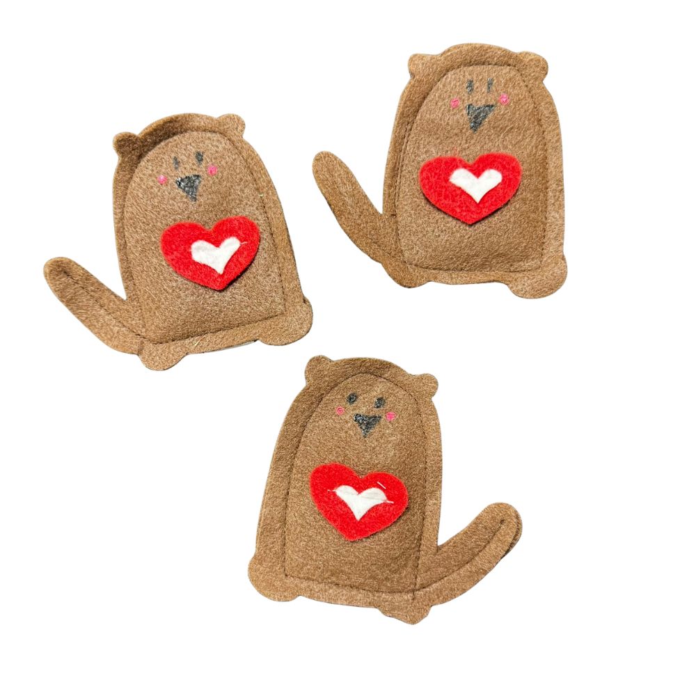 Group photo of handmade otter cat toys filled with premium catnip, brown felt otters with red heart accents, playful Valentine-inspired design. Made by CatnipTakeout.