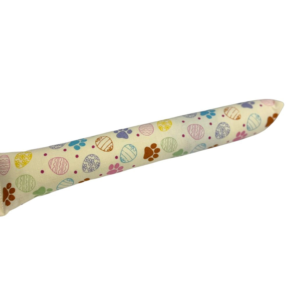 Cream pastel egg and paw print kicker cat toy with catnip in cotton fabric, durable for daily interactive play.