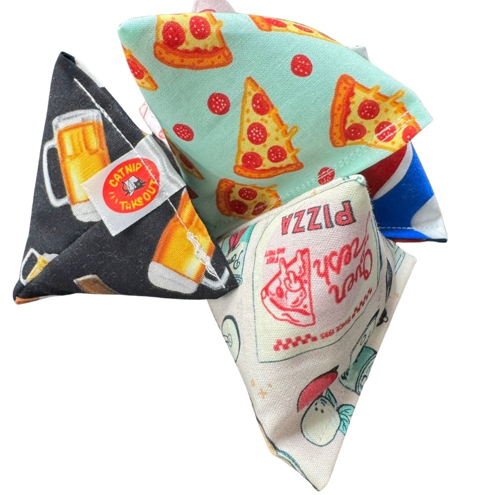 Stacked pizza cat toys showing multiple fabric variations
