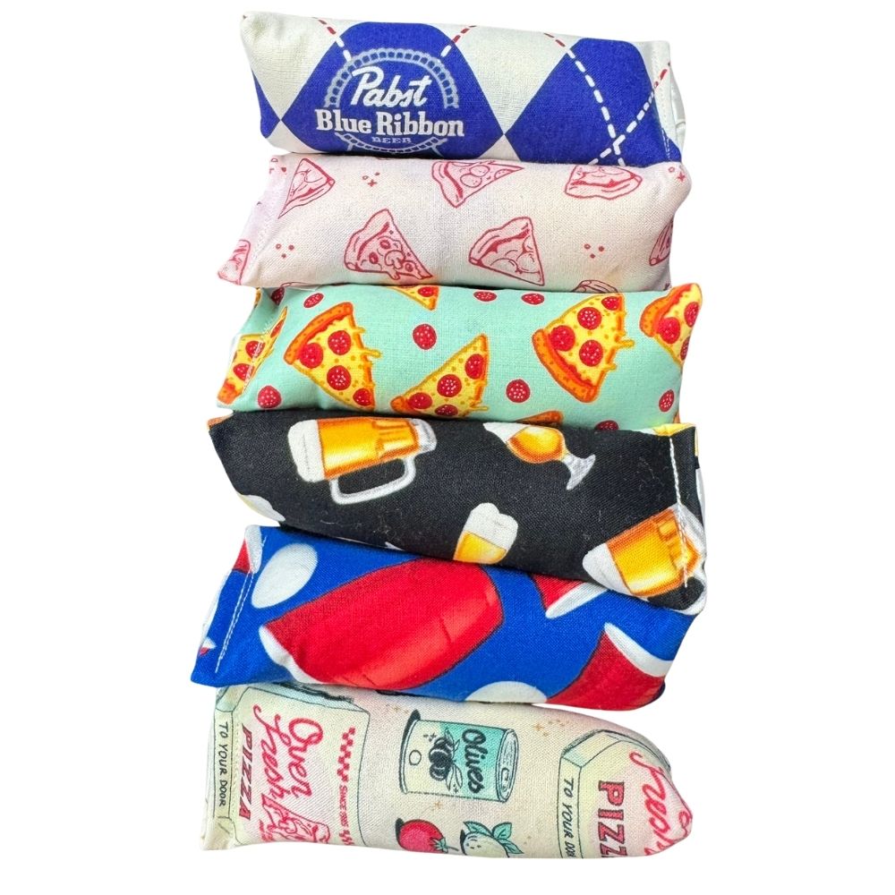 Assorted pizza themed cat toys including mini kickers and food shaped catnip toys