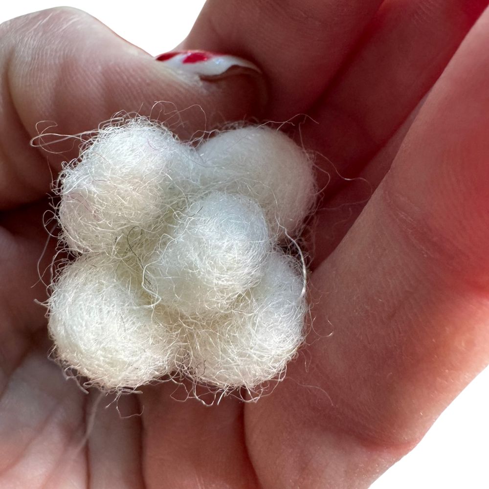 Close-up of popcorn-shaped cat toy sprayed with catnip, showing lightweight texture designed for batting and independent play by CatnipTakeout
