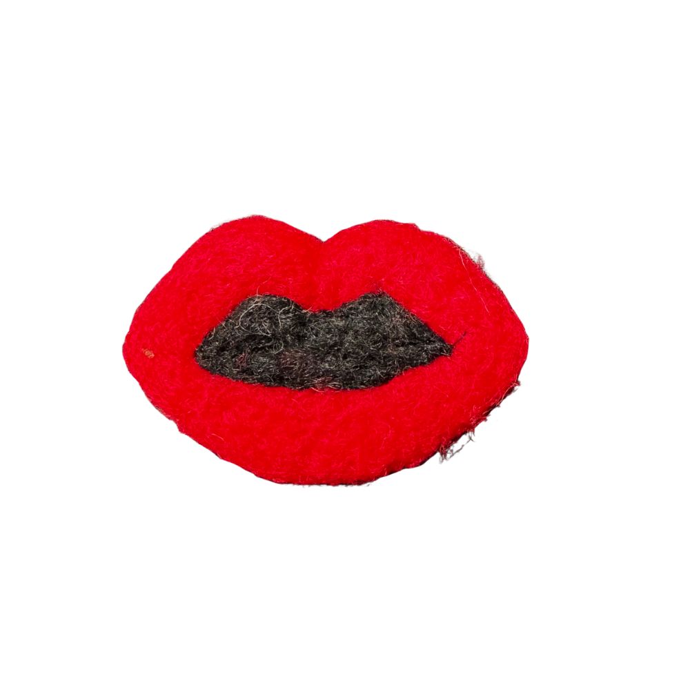 Red felt wool cat toy shaped like lips with black center detail, handmade and sprayed with CatnipTakeout signature catnip spray.